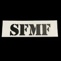 A black 'SFMF' sticker with die-cut rectangular letters on a white background